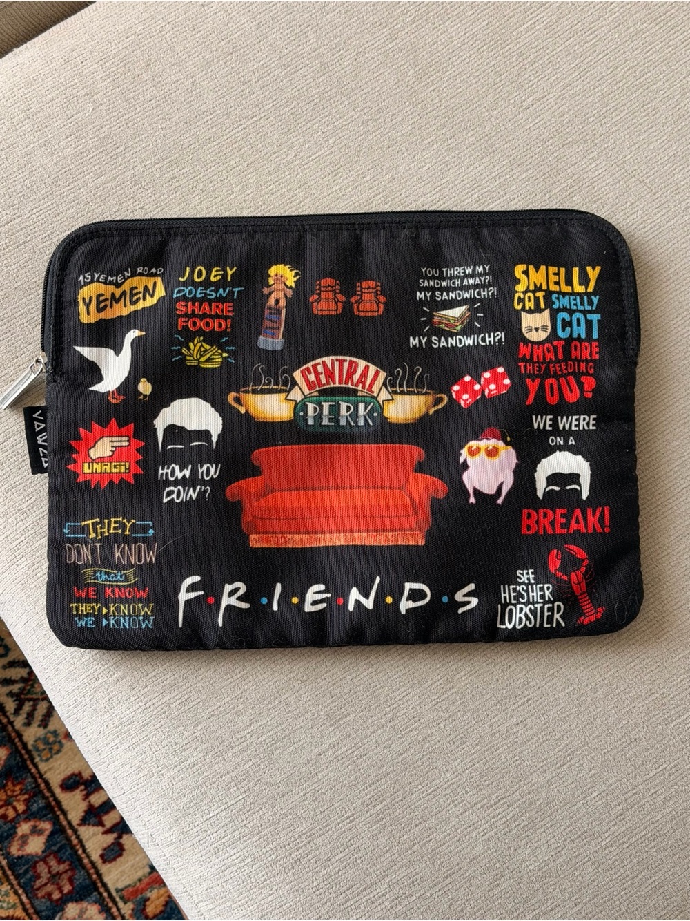 FRIENDS Central Perk Black Tablet Sleeve with Red Couch Design